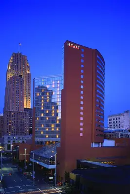 a tall building with a m matrix sign on it in a city at Hyatt Regency Cincinnati in Cincinnati