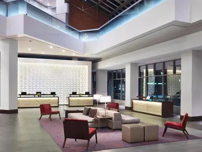 a lobby of a hotel with chairs and couches at Hyatt Regency Cincinnati in Cincinnati