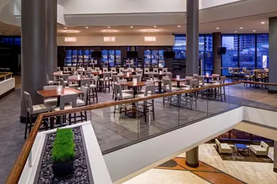a dining area with tables and chairs in a restaurant at Hyatt Regency Columbus in Columbus