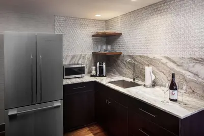 a kitchen with a refrigerator and a sink at Hyatt Regency Columbus in Columbus