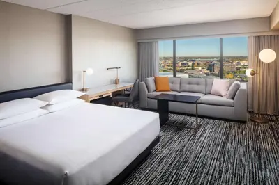 a hotel room with a bed and a couch at Hyatt Regency Columbus in Columbus