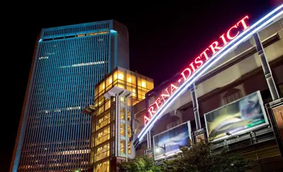 a building with a neon sign on it at night at Hyatt Regency Columbus in Columbus