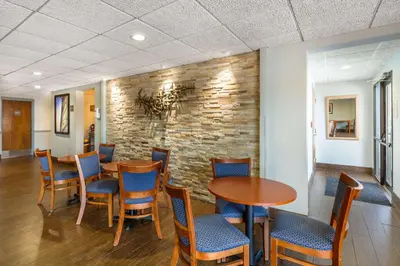 a dining room with a table and chairs at Best Western Port Clinton in Port Clinton