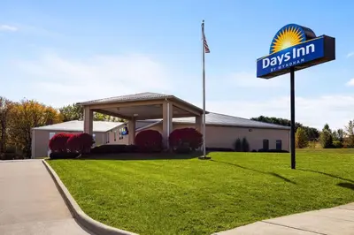 a day inn sign in front of a building at Days Inn by Wyndham Hillsboro in Hillsboro