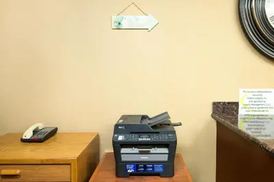 a fax machine sitting on top of a desk at Super 8 by Wyndham Ripley in Ripley