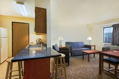 a kitchen and living room with a kitchen and a living room at Super 8 by Wyndham Ripley in Ripley