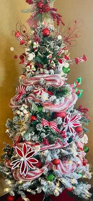 a christmas tree is decorated with candy canes at Super 8 by Wyndham Ripley in Ripley