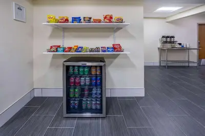 a soda vending machine in a room with drinks at Days Inn by Wyndham Grayson in Grayson