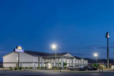 a gas station with cars parked in a parking lot at Days Inn by Wyndham Grayson in Grayson