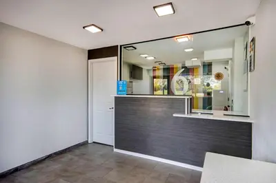 a store front with a mirror and a door at Motel 6 Columbus OH - OSU North in Columbus