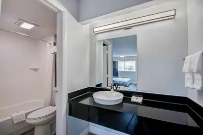a bathroom with a sink and a toilet at Motel 6 Columbus OH - OSU North in Columbus