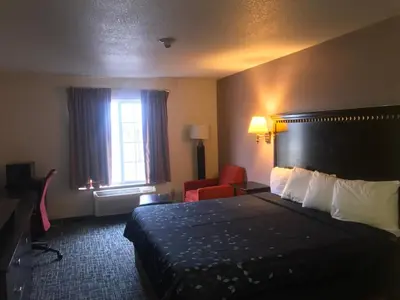 a hotel room with a bed and a window at Pier Inn in Luna Pier
