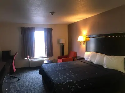 a hotel room with a bed and a window at Pier Inn in Luna Pier