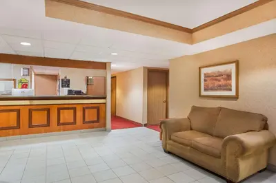 a waiting room with a couch in a hospital at Super 8 by Wyndham Defiance in Defiance