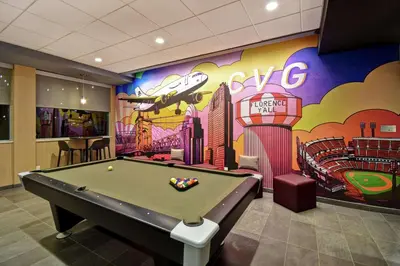 a pool table in a room with a mural at Tru By Hilton Cincinnati Airport South Florence in Florence