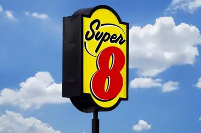 a sign for a super eight restaurant on a pole at Super 8 by Wyndham Youngstown Girard in Youngstown