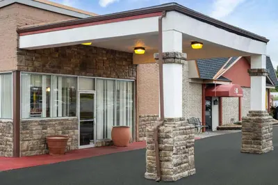 a building with awning on the side of it at Super 8 by Wyndham Youngstown Girard in Youngstown