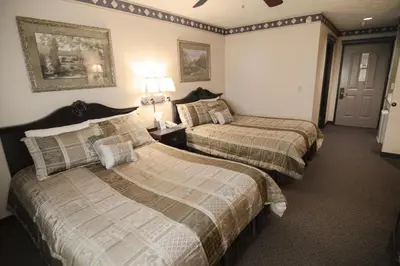 a hotel room with two beds in a room at Hearthstone Inn & Suites in Cedarville