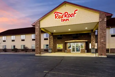 a red rock inn sign on the front of a building at Red Roof Inn Auburn in Auburn