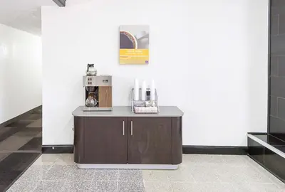 a coffee machine sitting on a counter in a room at Motel 6-Sidney, OH in Sidney