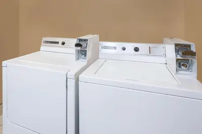 two machines sitting on top of a white refrigerator at Super 8 by Wyndham Seville in Seville