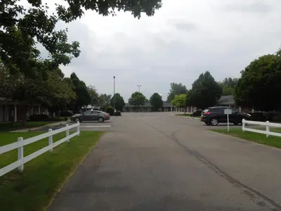 a street in a residential neighborhood with cars parked at Bryan Inn in Bryan