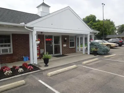 a parking lot in front of a building at Bryan Inn in Bryan