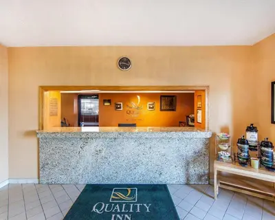 a lobby of a quality inn with a welcome mat in front at Quality Inn Maysville in Maysville