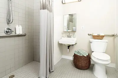 a bathroom with a toilet and a sink at InTown Suites Extended Stay Cincinnati OH - Fairfield in Fairfield