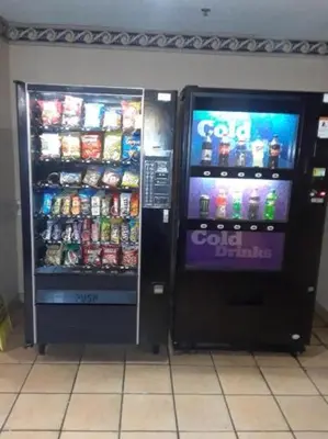 two soda machines are standing next to each other at InTown Suites Extended Stay Cincinnati OH - Fairfield in Fairfield