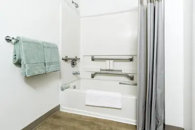 a bathroom with a towel rack and a shower at InTown Suites Extended Stay Cincinnati OH - Colerain in Cincinnati