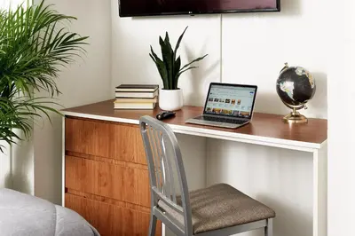 a desk with a laptop computer on top of it at InTown Suites Extended Stay Columbus OH - Dublin in Columbus