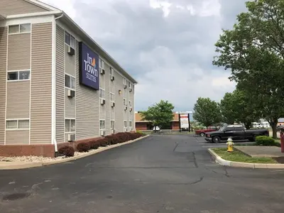 a building with a hotel sign on the side of it at InTown Suites Extended Stay Select Dayton OH- Miamisburg in Dayton