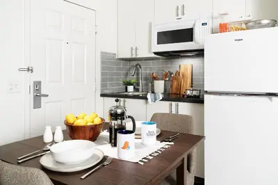 a kitchen table with a bowl of fruit on it at InTown Suites Extended Stay Select Dayton OH- Miamisburg in Dayton