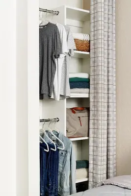 a closet filled with lots of clothes at InTown Suites Extended Stay Columbus OH - I-70E Hamilton Rd in Columbus