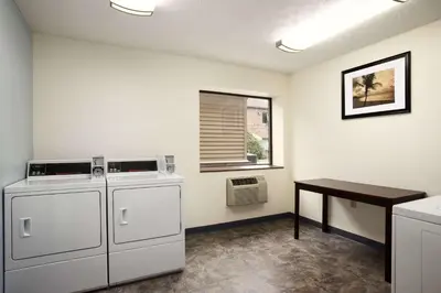 a room with two machines and a table in it at Days Inn by Wyndham Middletown in Middletown