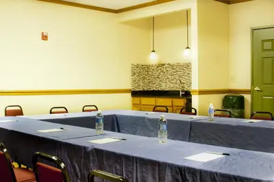 a room with a table with two bottles of water on it at Country Inn & Suites by Radisson, Macedonia, OH in Macedonia
