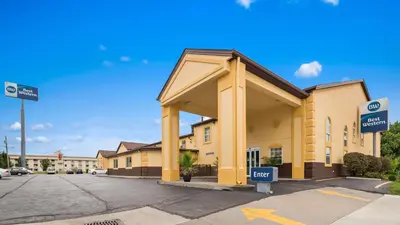 a building with a for sale sign in a parking lot at Best Western Elyria in Elyria