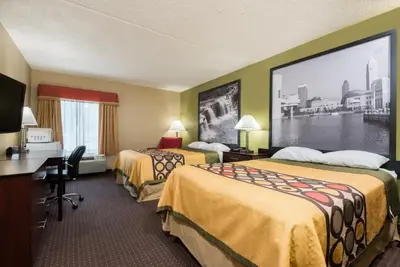 a hotel room with two beds and a large window at Super 8 by Wyndham Miamisburg Dayton S Area OH in Miamisburg