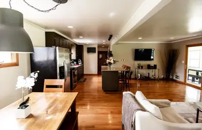 a living room with a couch and a table at The Broadway Guest House in Granville