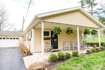 a house with a porch with chairs on it at The Broadway Guest House in Granville