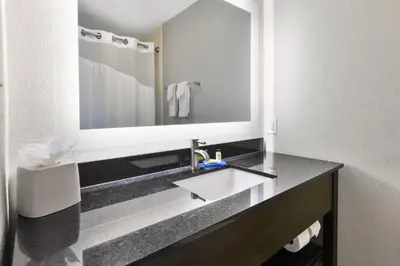a bathroom with a sink and a large mirror at Holiday Inn Express Chillicothe East by IHG in Chillicothe