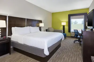 a hotel room with a large bed and a desk at Holiday Inn Express Chillicothe East by IHG in Chillicothe