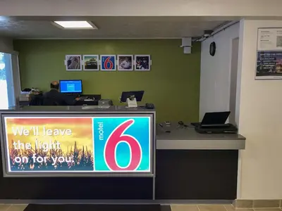 an office with a desk with a sign on it at Motel 6-North Olmsted, OH - Cleveland in North Olmsted