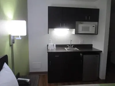 a small kitchen with a sink and a microwave at Motel 6-North Olmsted, OH - Cleveland in North Olmsted