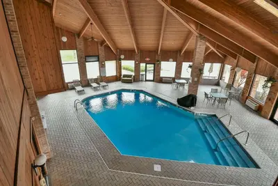 an overhead view of a swimming pool in a house at Baymont by Wyndham Zanesville in Zanesville