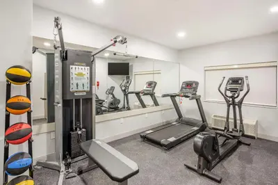 a gym with several exercise bikes and a mirror at Best Western River Cities in Ashland