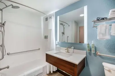a bathroom with a sink and a shower and a tub at Best Western River Cities in Ashland