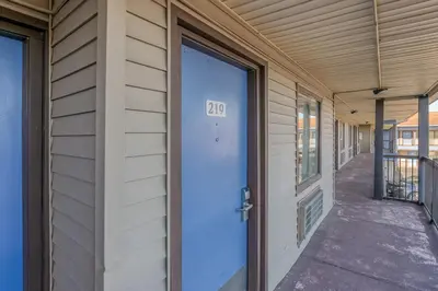 a door with the number on it on a building at FairBridge Inn Express North Lima in North Lima
