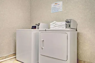 a small white refrigerator in a room at Baymont by Wyndham Washington Court House in Jeffersonville